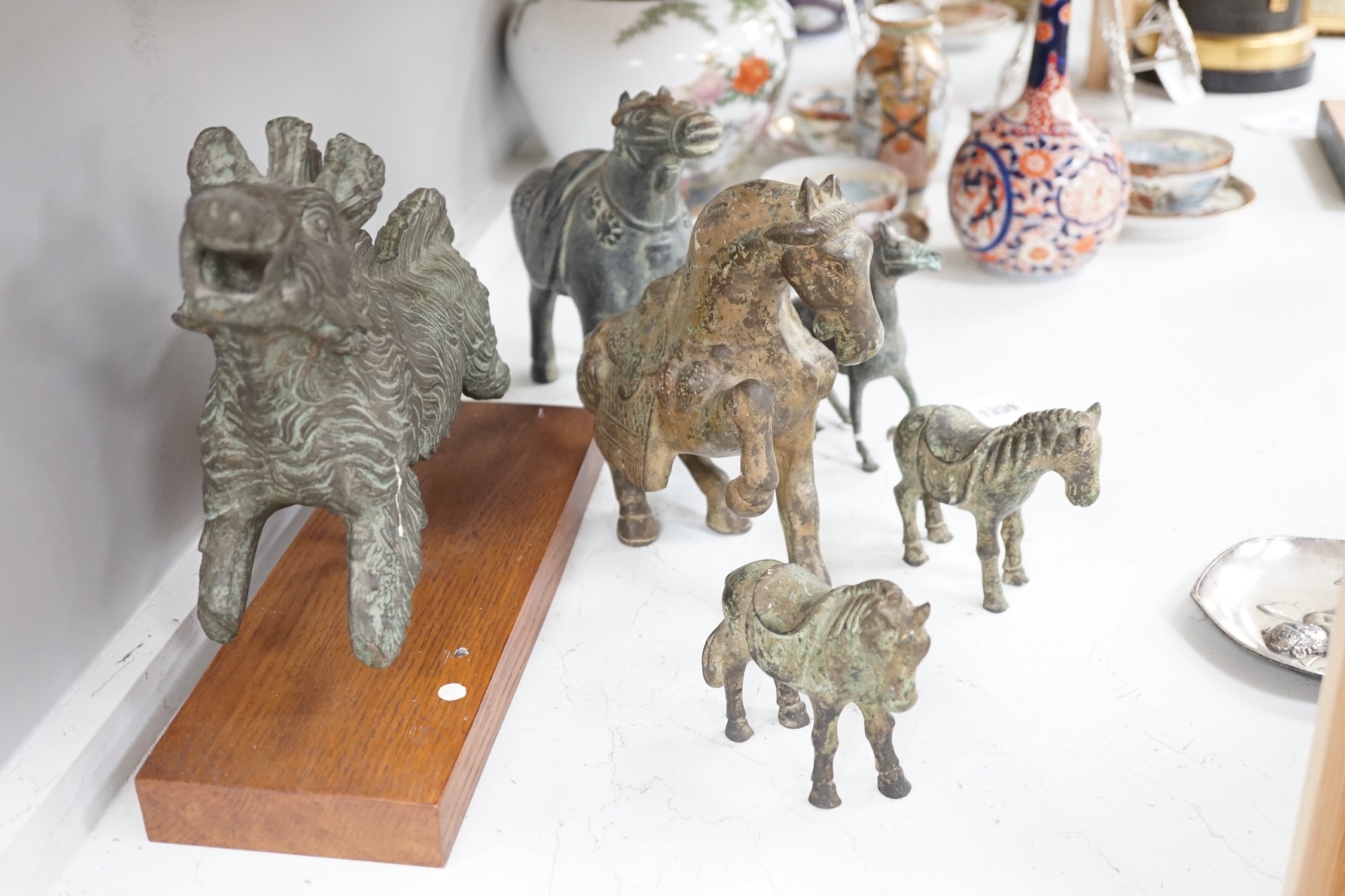 A group of reproduction bronze figures after early Chinese and other examples from antiquity, tallest 21cm